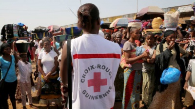 Red Cross volunteer at an Ebola awareness campaign in Matoto Market, Conakry, Guinea